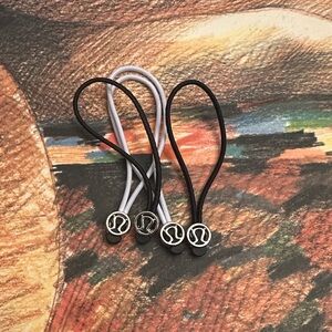 Lululemon Hair Ties or zipper pull set black and white with silver accents